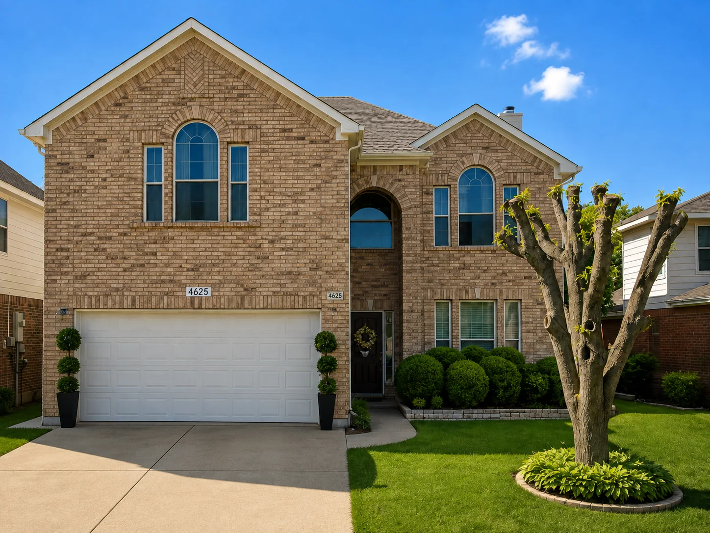 Completed AAHR replacement window project on a North Texas brick home with arched windows