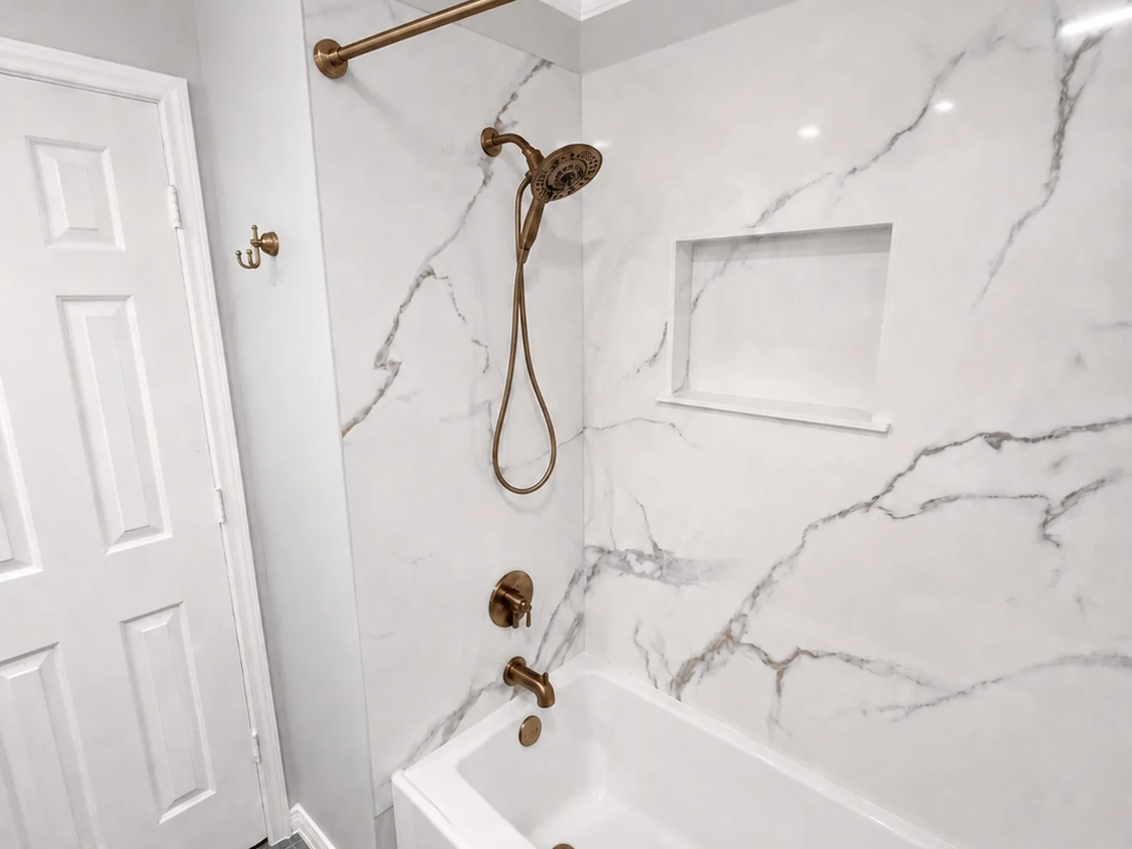 Bathtub replacement with champagne bronze fixtures