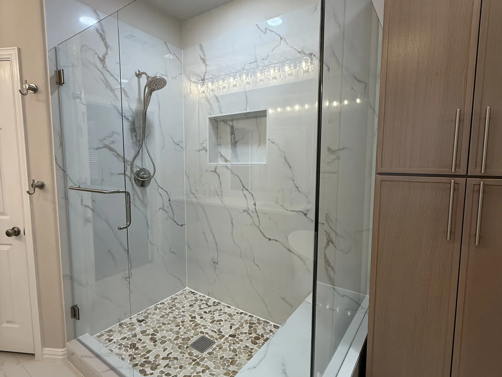 Enlarged shower with coordinating linen tower