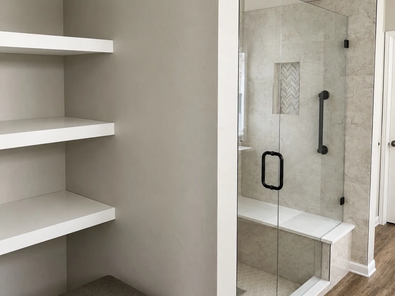 Shower converted to open linen storage with tub-to-shower project